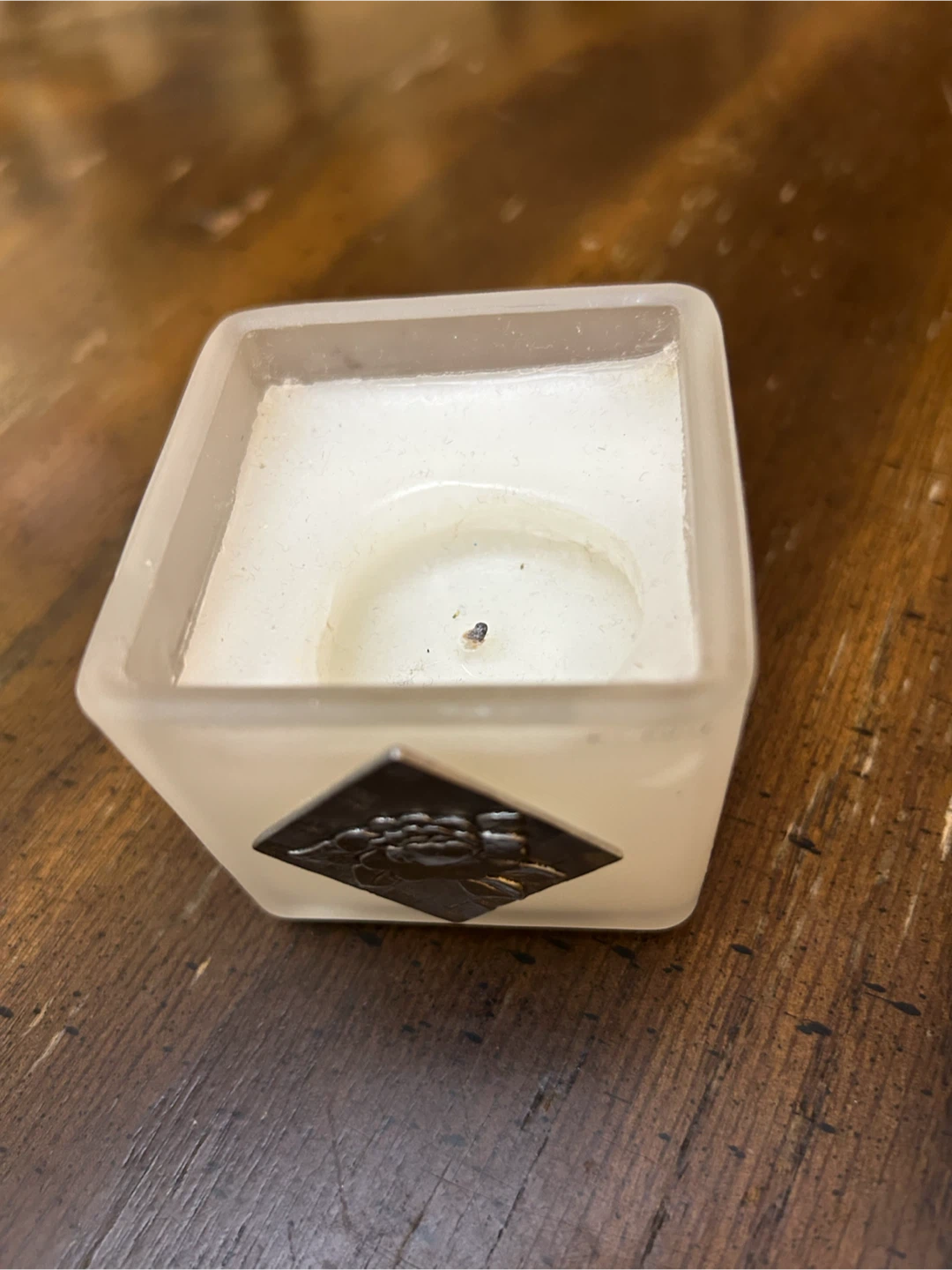 Frosted glass votive candle holder with decorative accent
