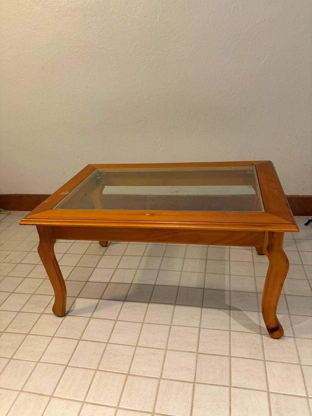 Wooden coffee table with glass top