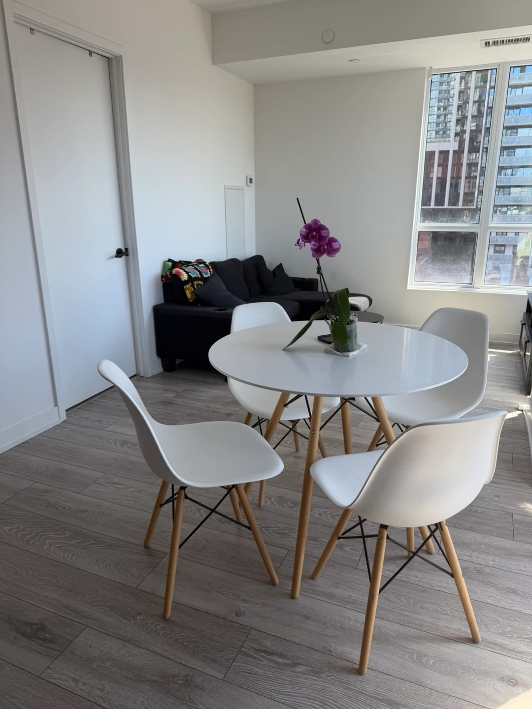 White Round Dining Table and Four Chairs