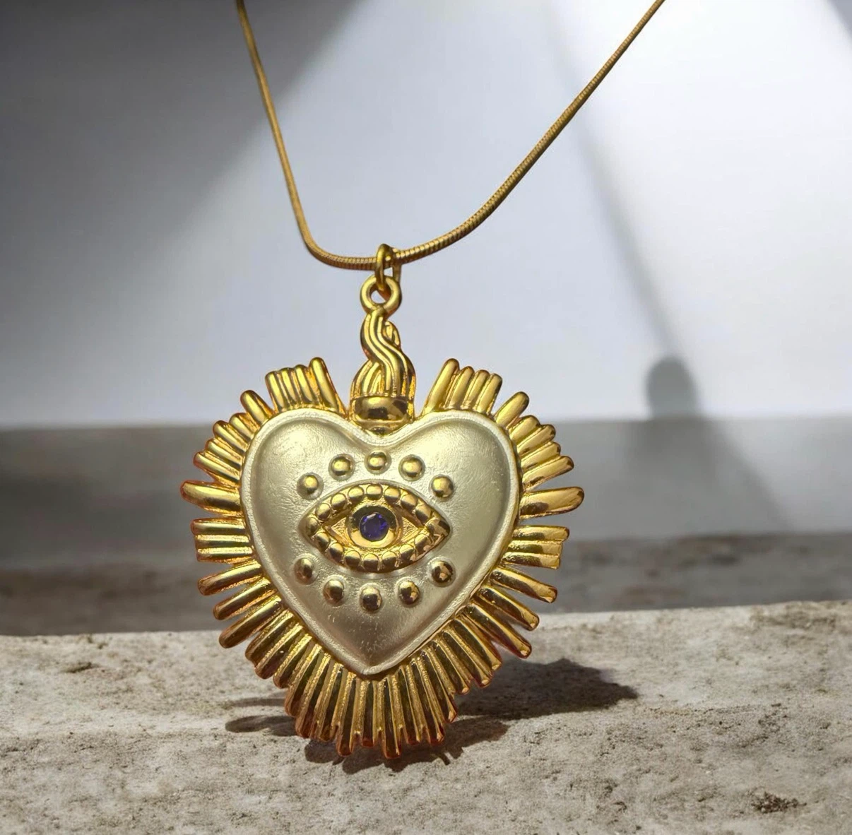 Goldtone Heart Eye Pendant Necklace