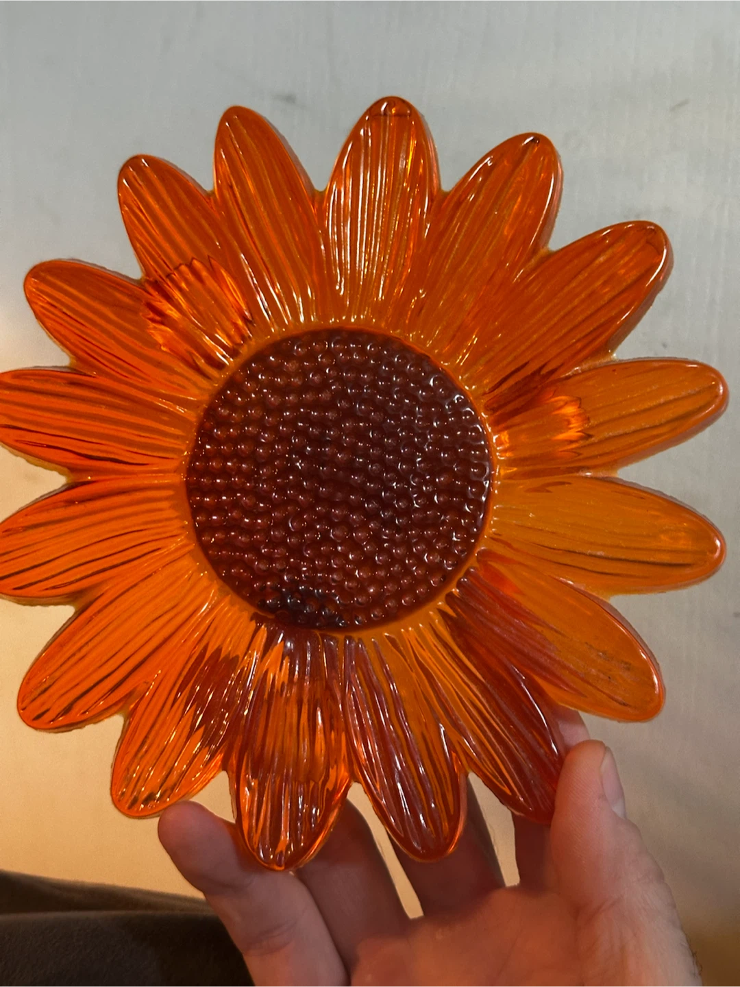 Orange lucite flower trivet