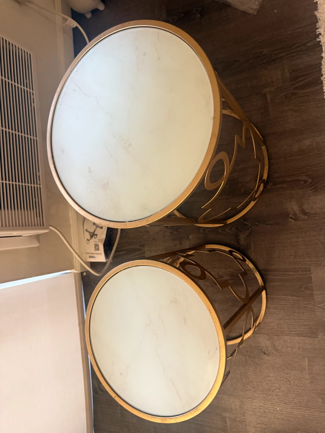 Set of two gold metal and marble side tables