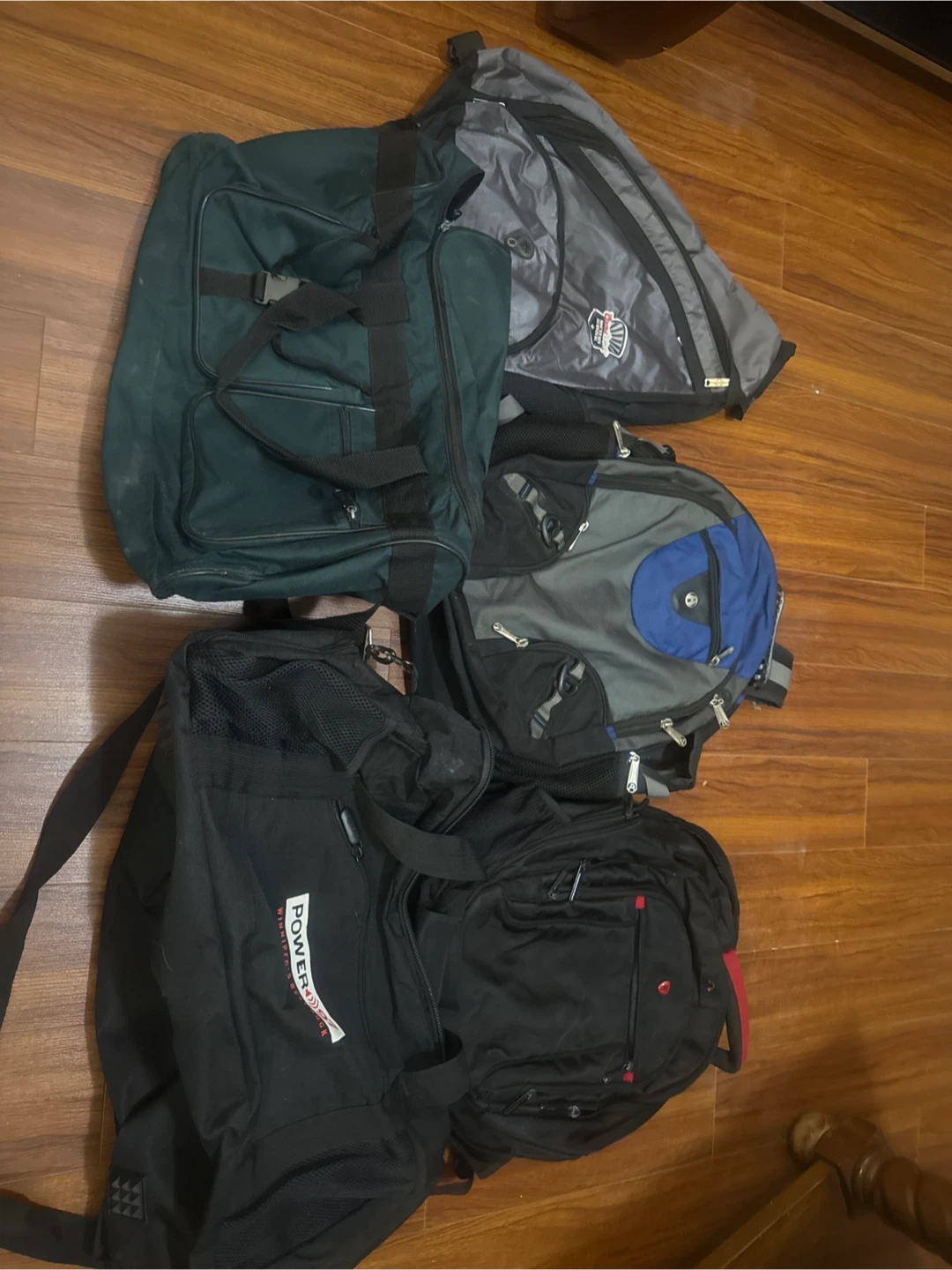 Assorted backpacks and duffel bag collection