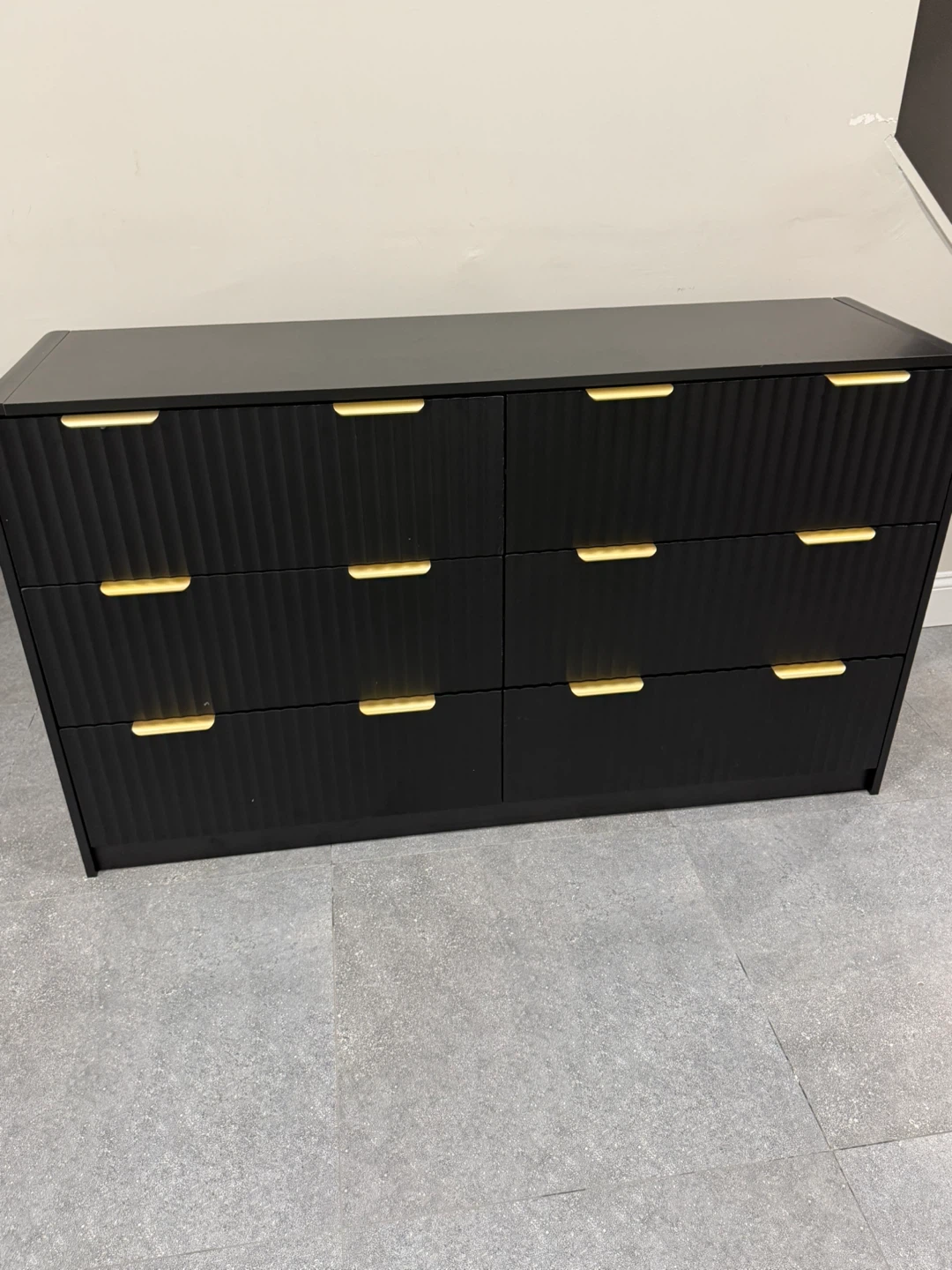 Black dresser with gold handles