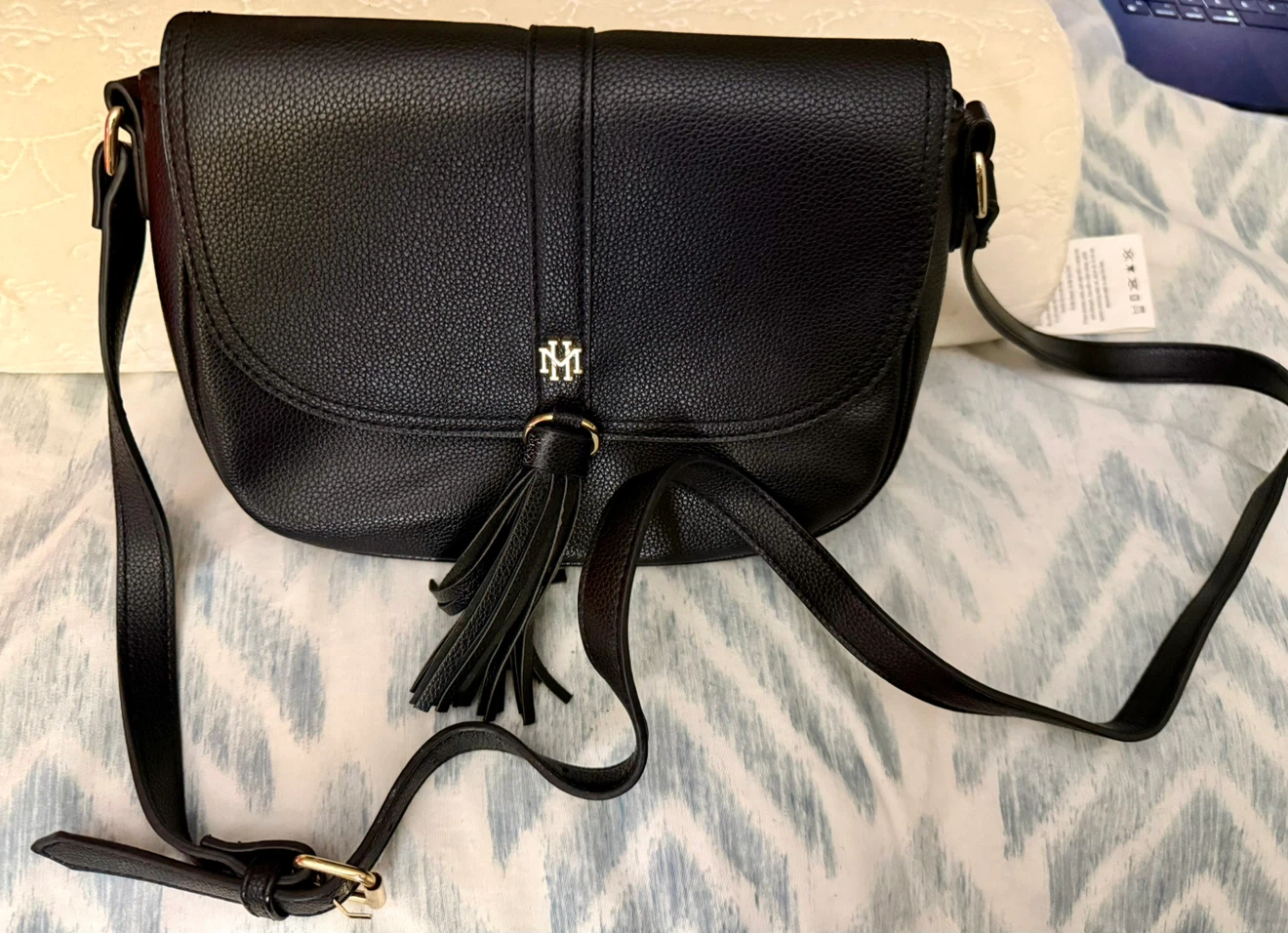 Black crossbody bag with tassel and gold logo - photo 2