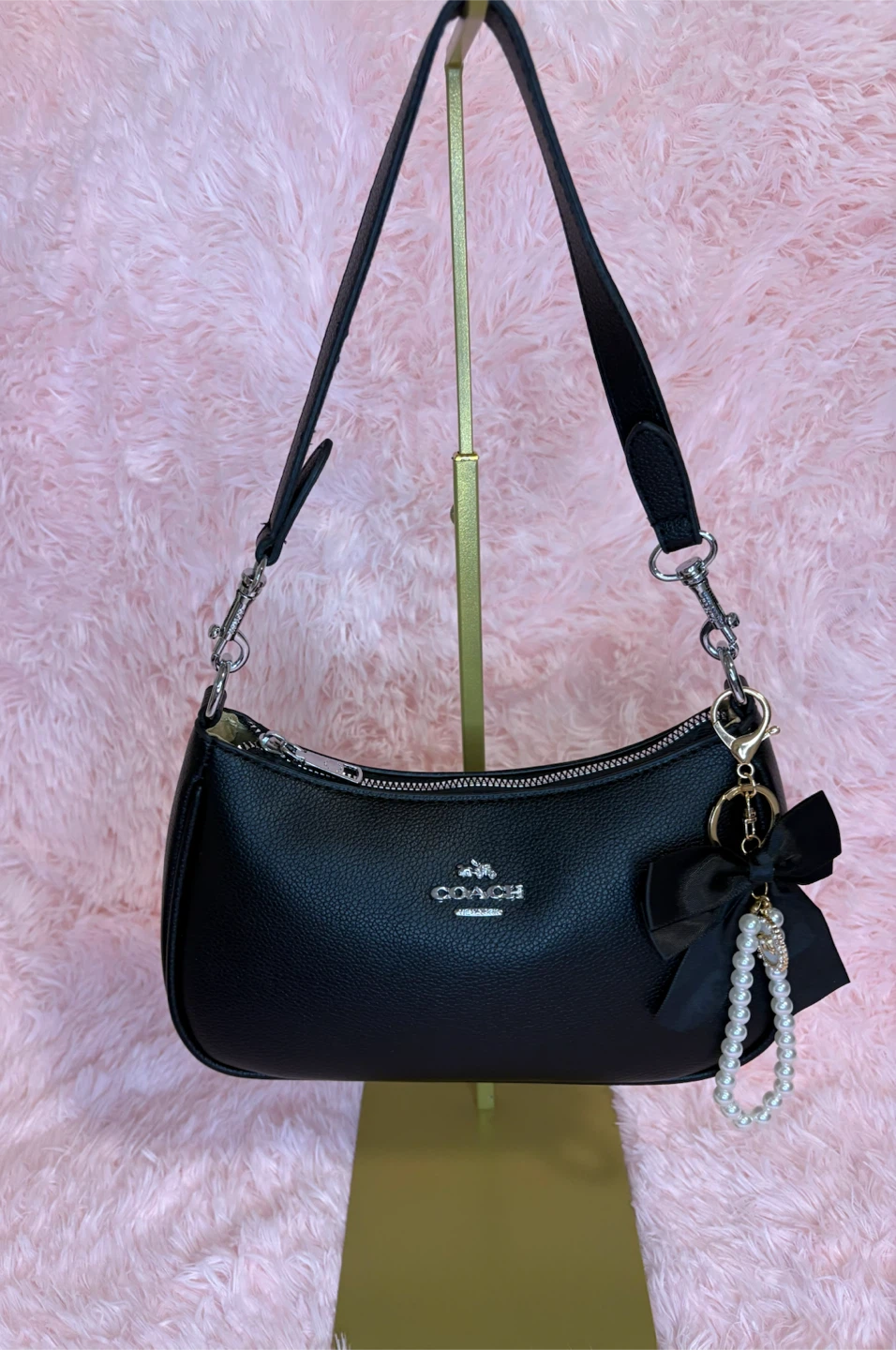 Cartera coach negra 60$