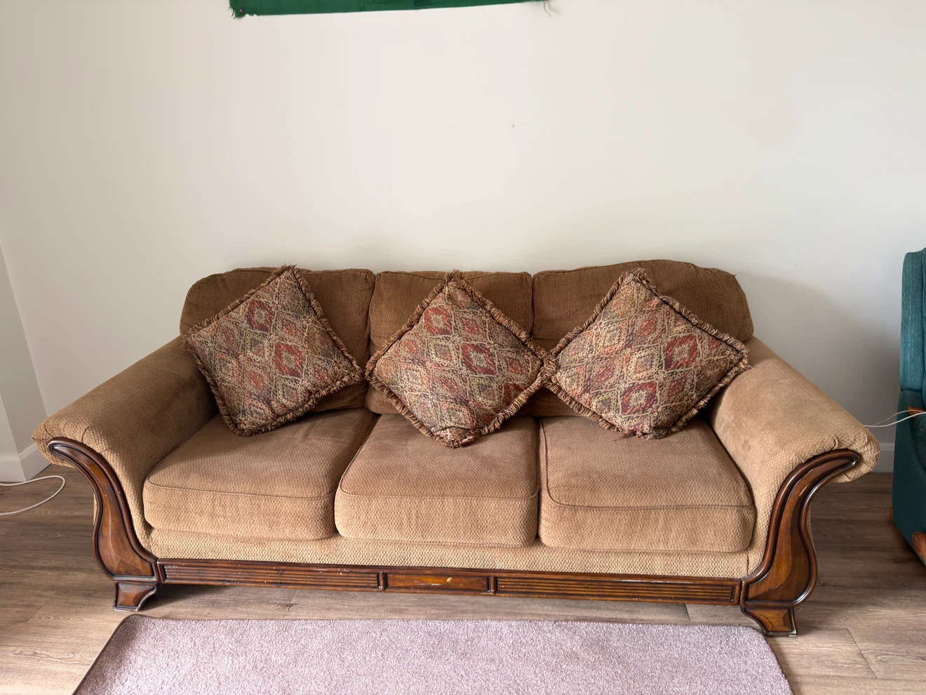 Three-seater brown sofa