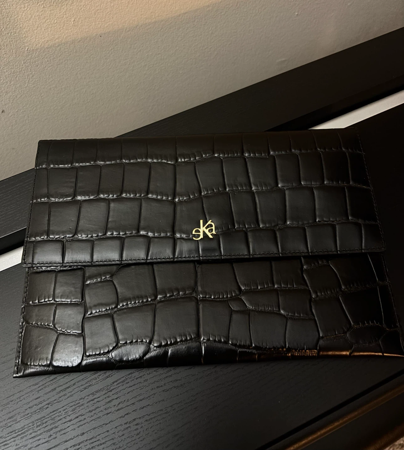 Black croc patterned clutch