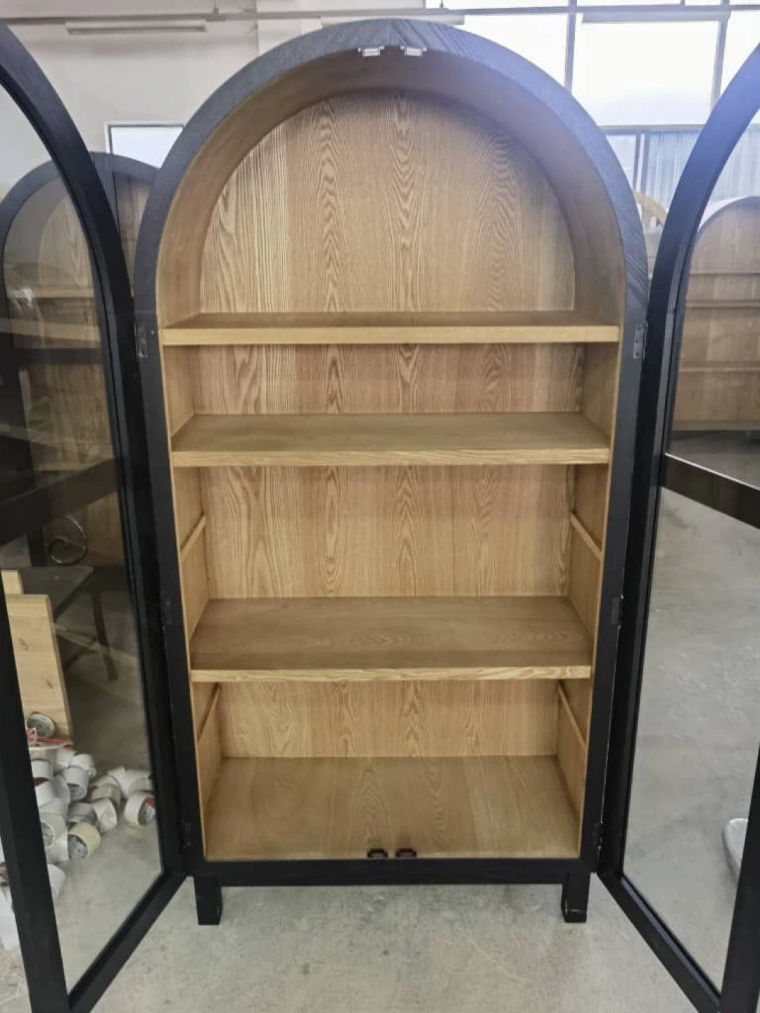 Black arched glass display cabinet