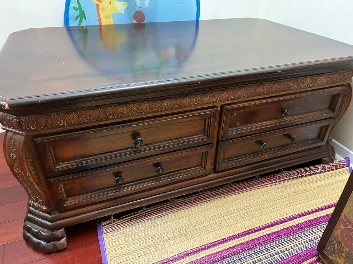 Dark wood coffee table with storage drawers