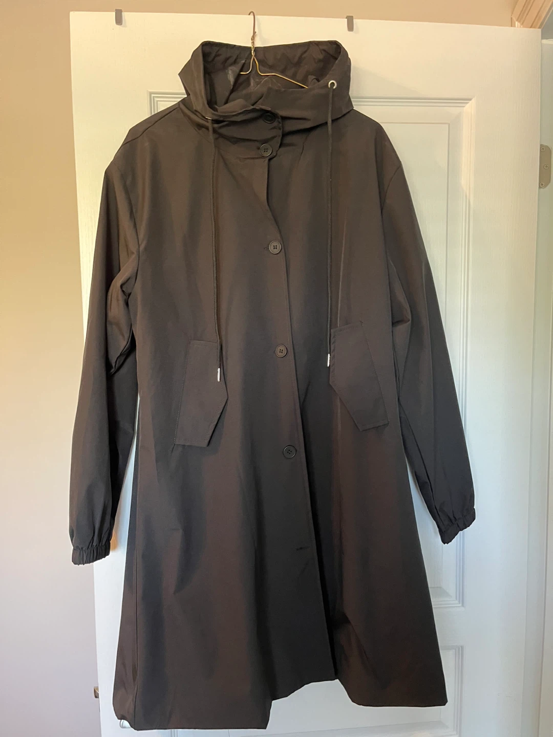 Brand new Black Hooded Rain Jacket fully lined. Medium