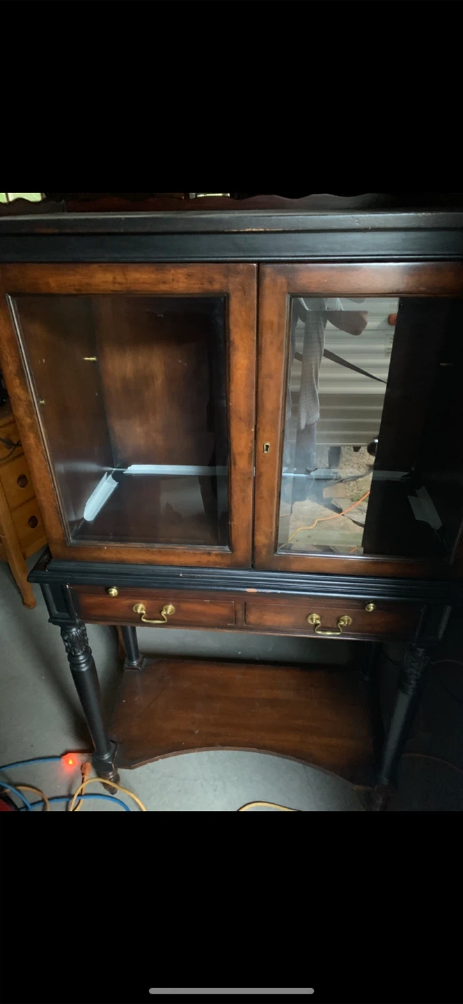 Vintage wooden display cabinet with glass doors