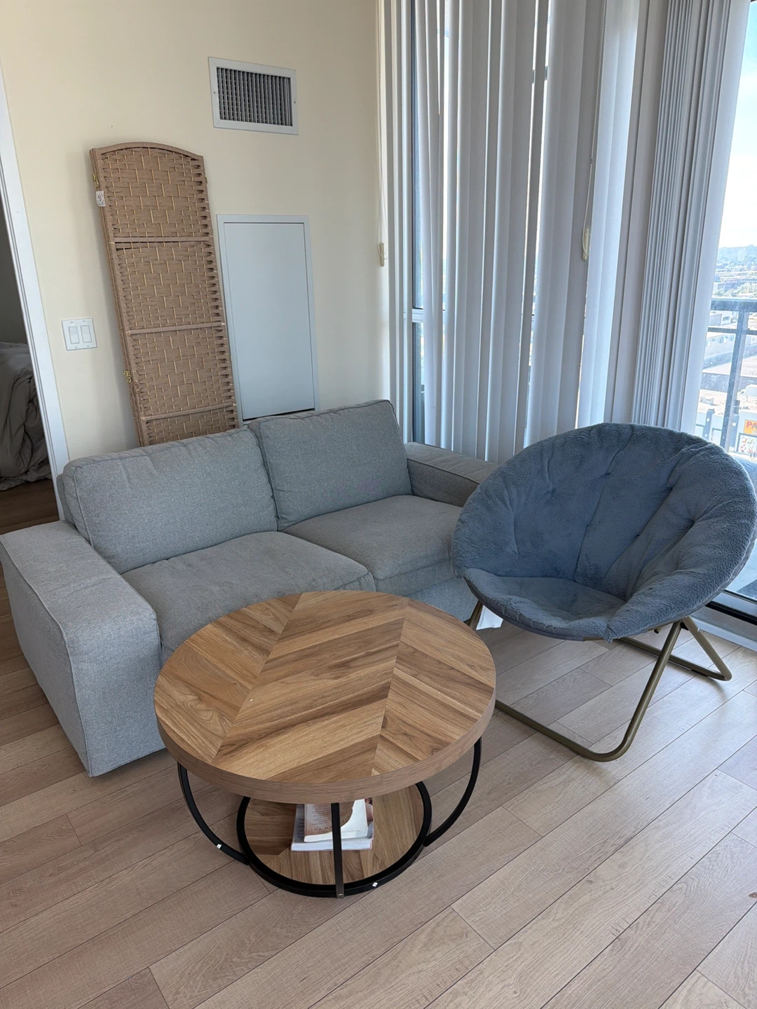 Round wooden coffee table, couch & foldable chair