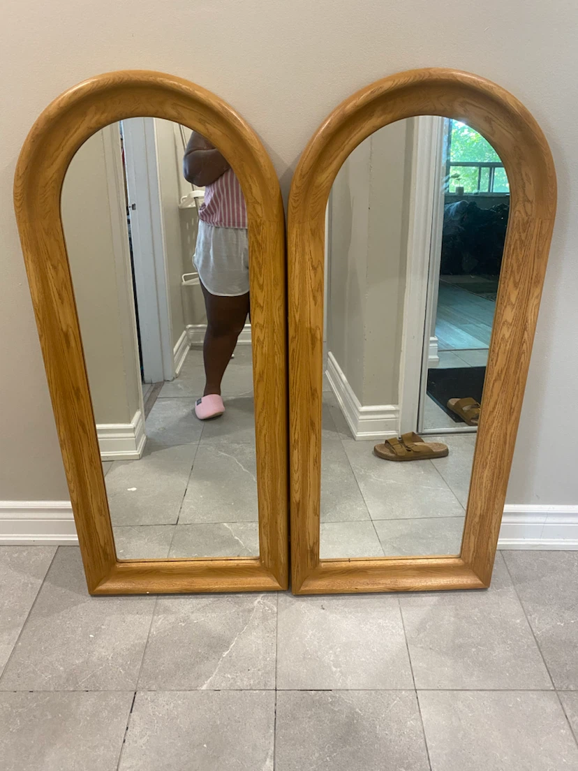Pair of arched top mirrors with wood frames