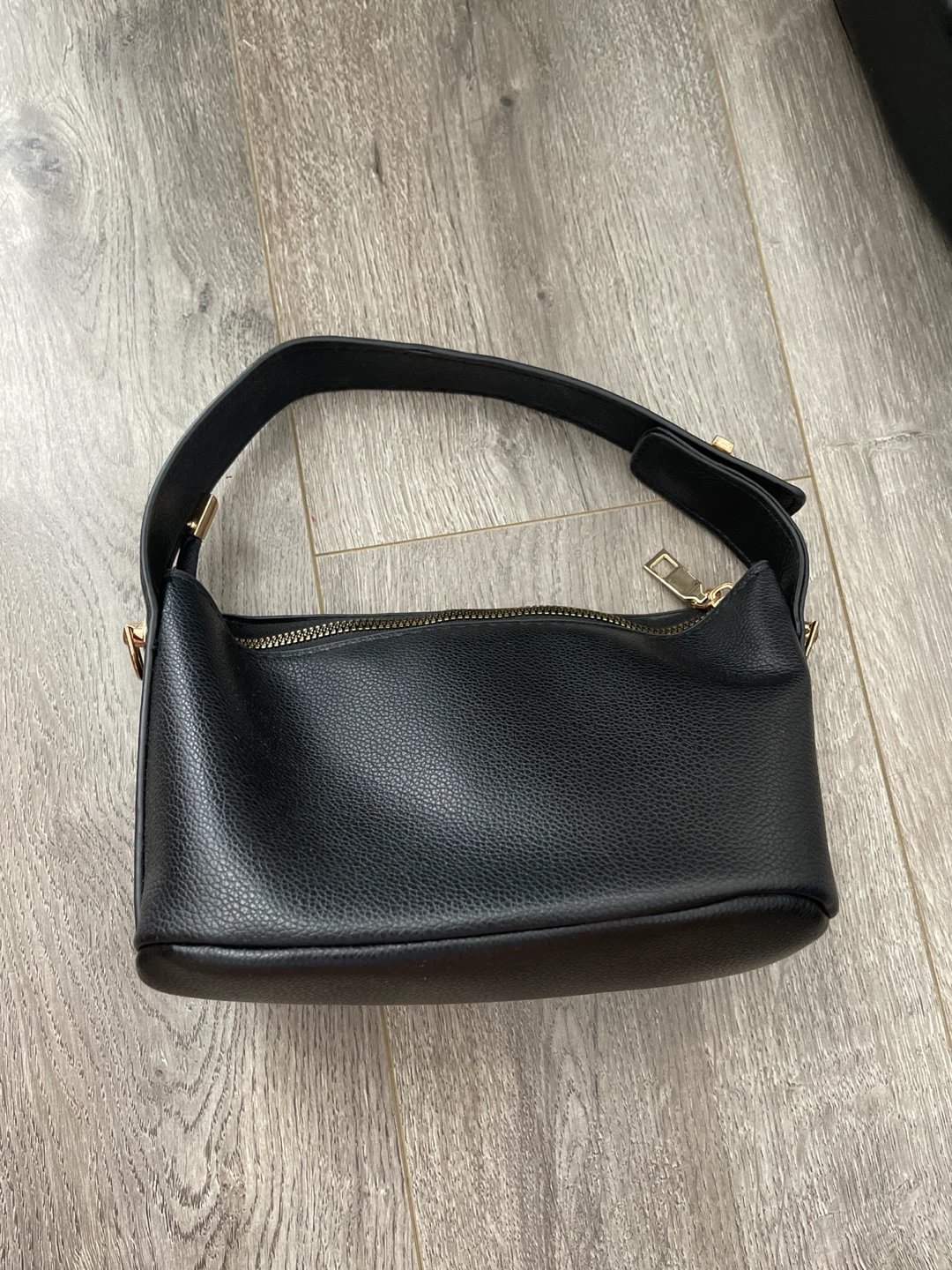 Black bag with gold clasp