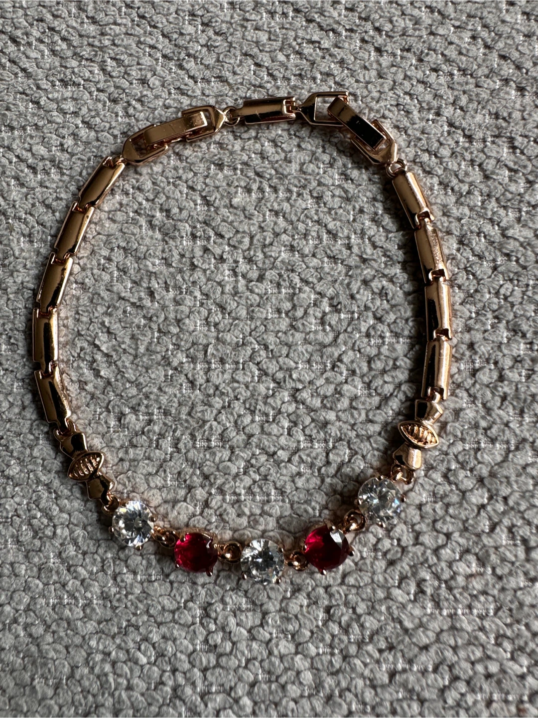 Rose Gold Tone Bracelet with Red and Clear Stones