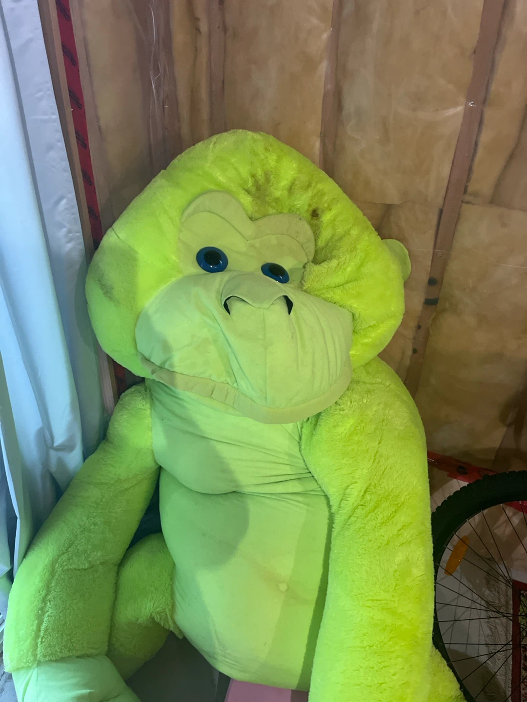 Large neon green plush gorilla toy