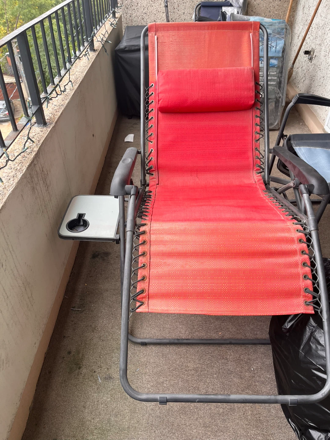 Red folding zero-gravity lounge chair