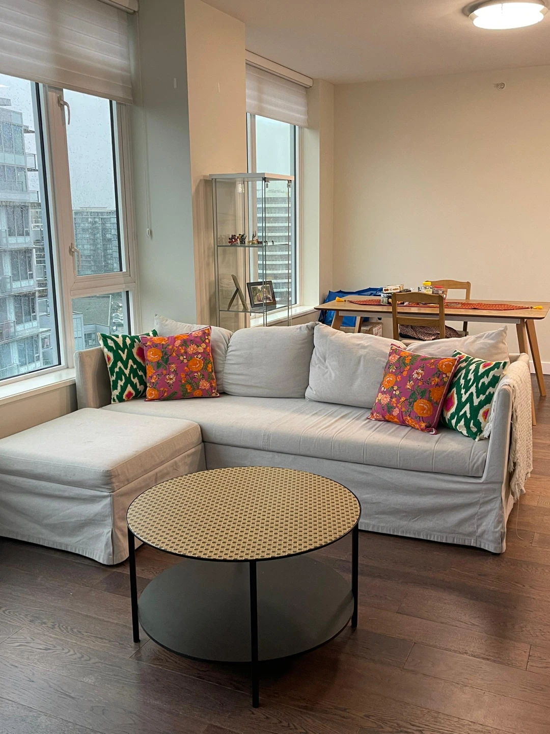 IKEA Sofa-bed with storage and round glass coffee table