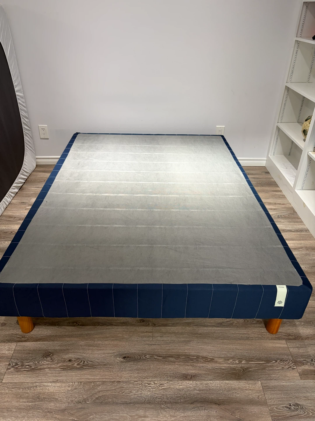 Navy Blue Bed Frame with Wooden Legs by Zinus brand.