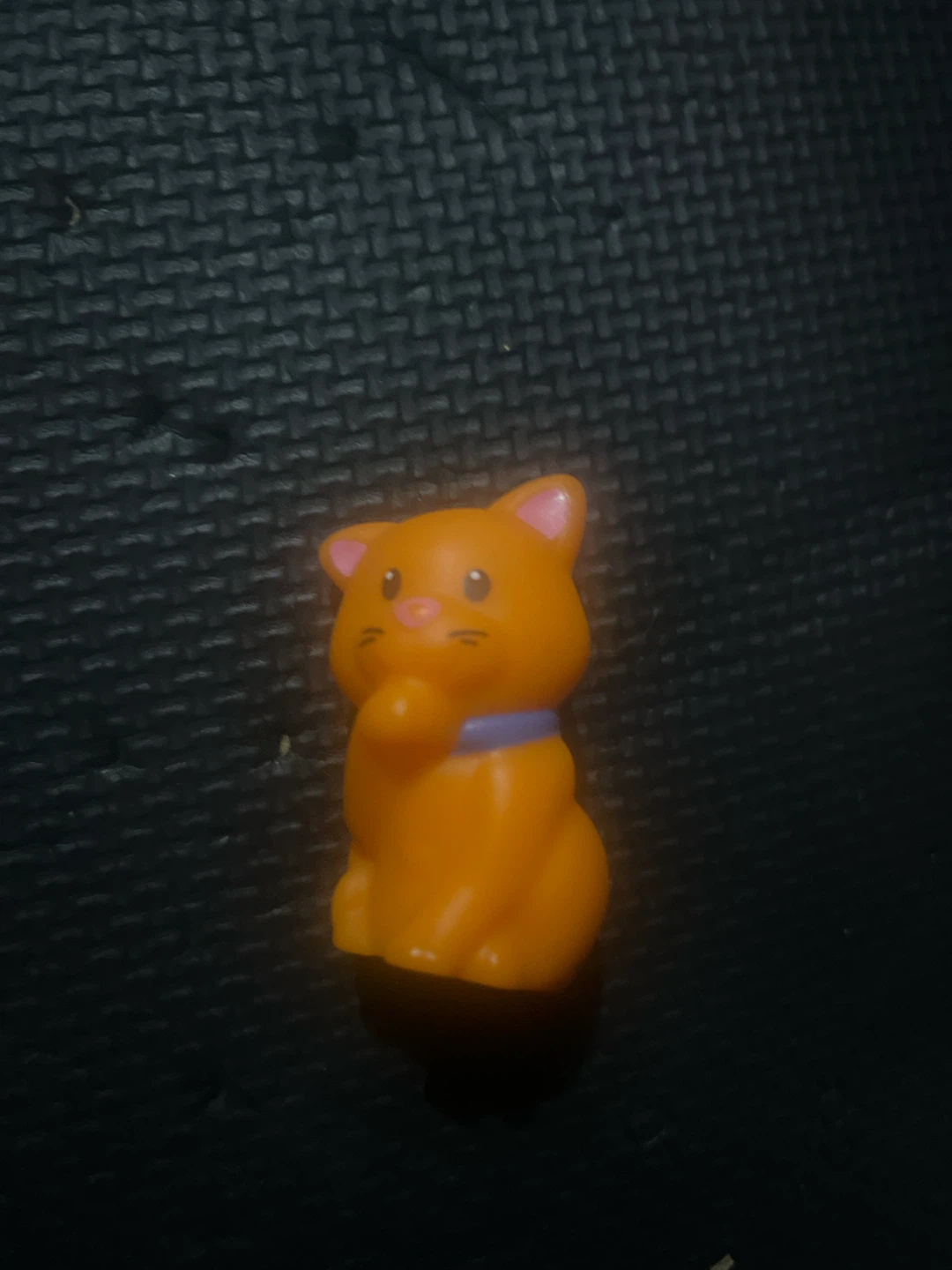 Small orange cat toy figurine