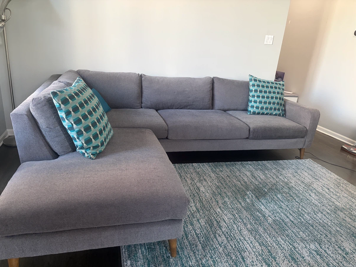 L shaped couch, throw pillows and area rug set
