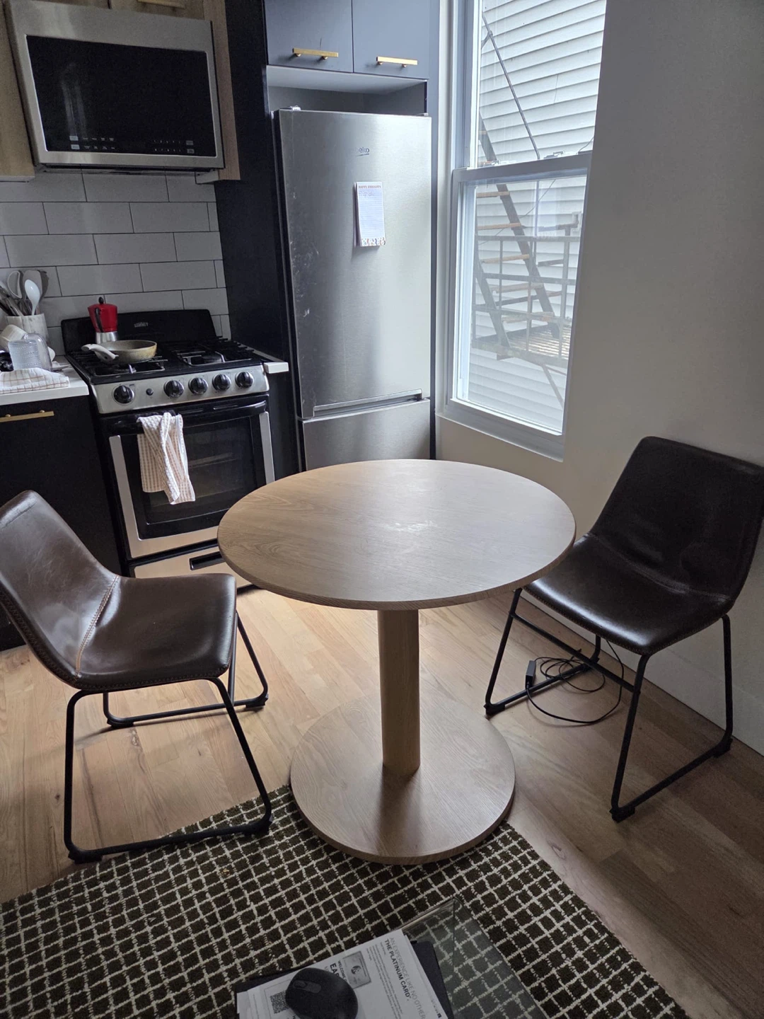 2 Brown Leather Chairs & Round Oak Table
