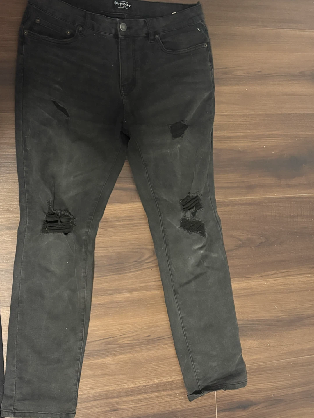 Two pairs of men's black denim jeans