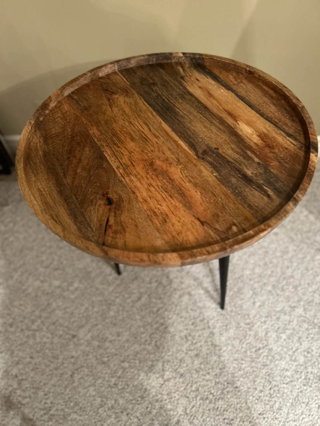 Round wooden side table with metal legs