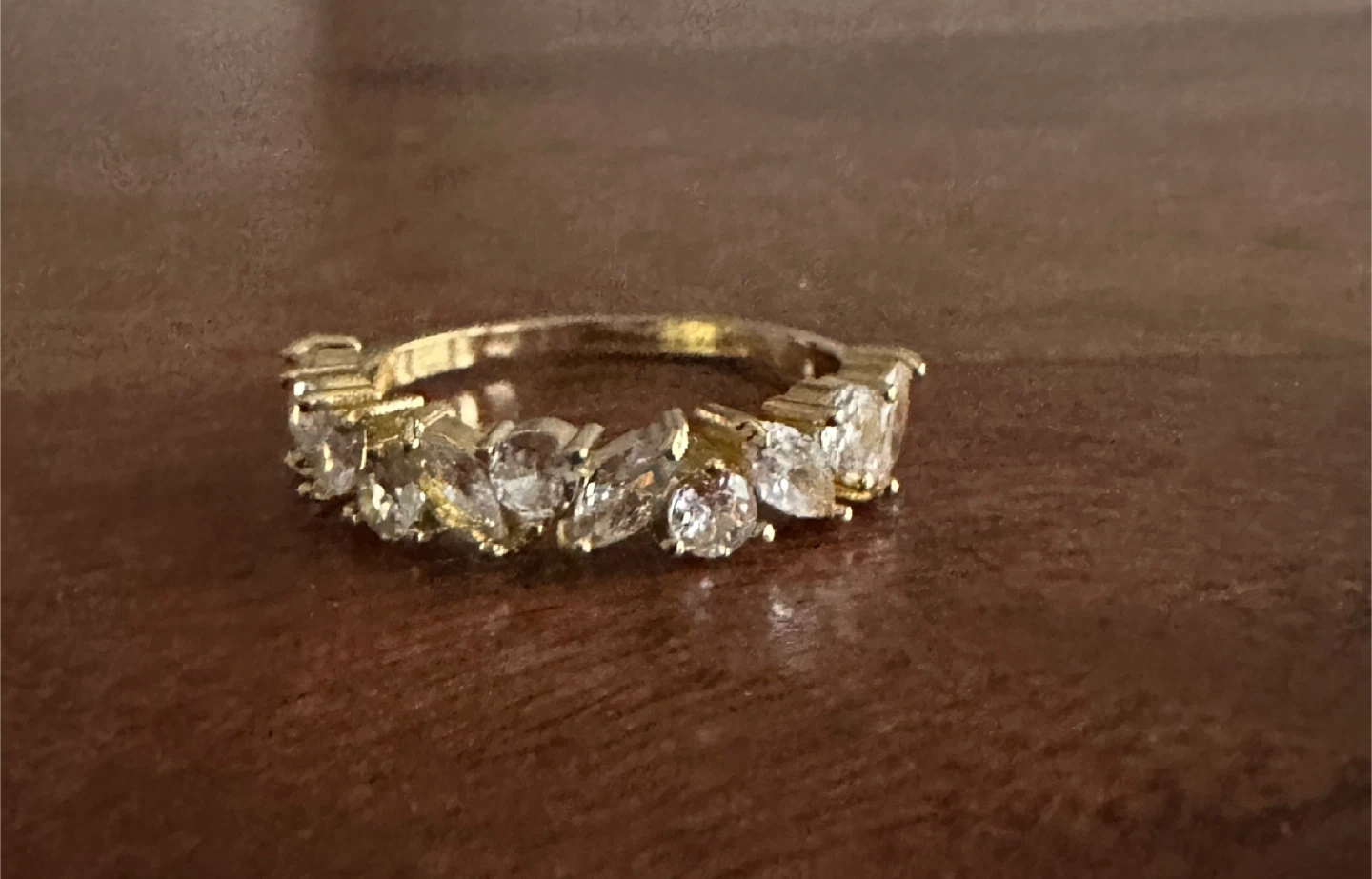 Gold-tone ring with clear stones