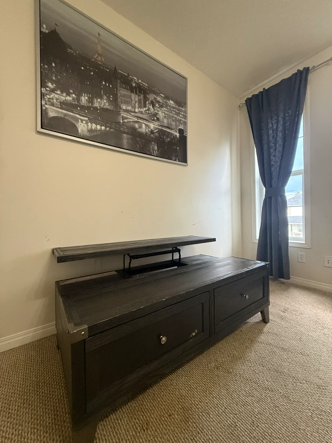 Black wooden lift-top coffee table