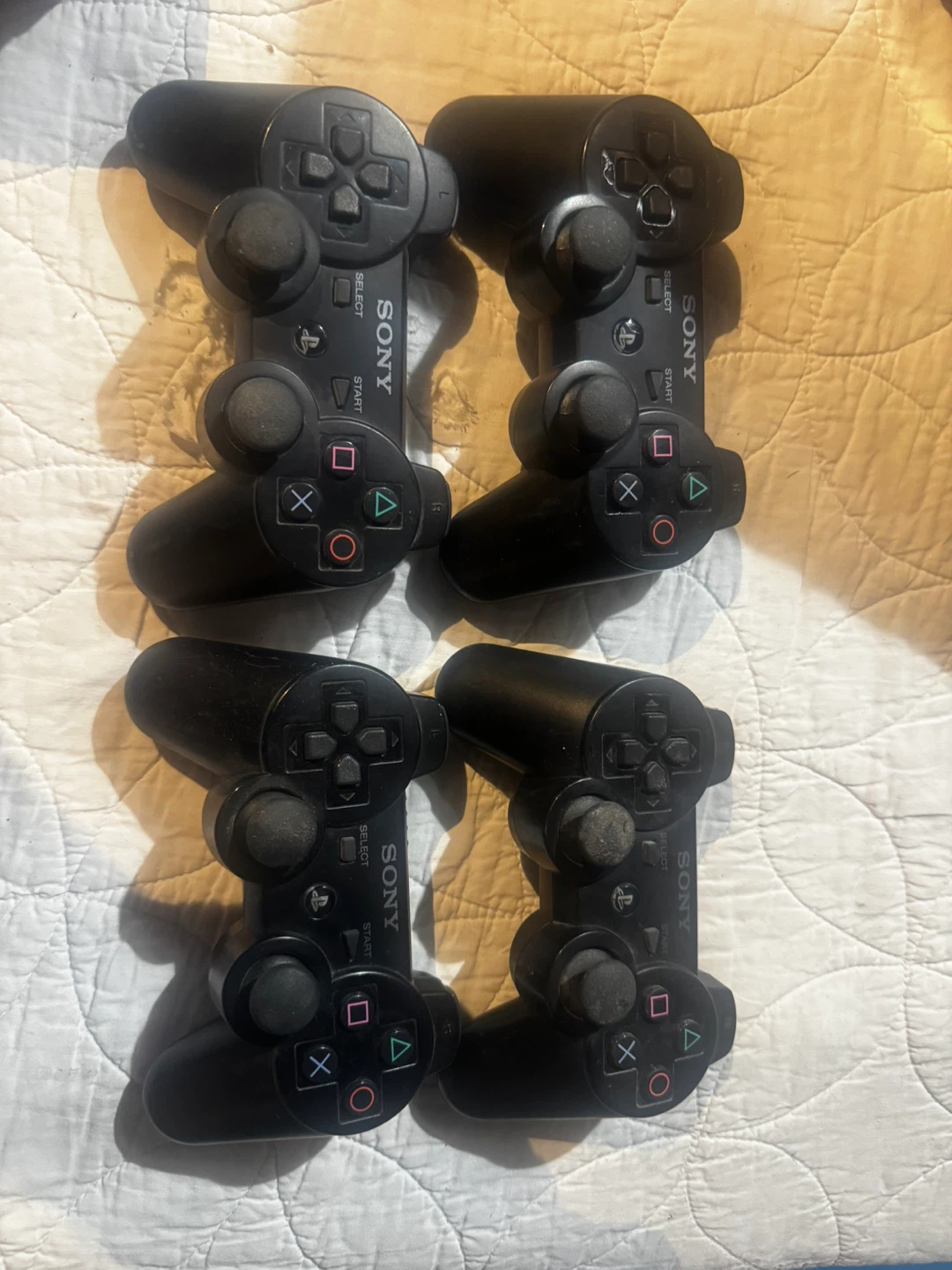 Four Sony PlayStation 3 Controllers