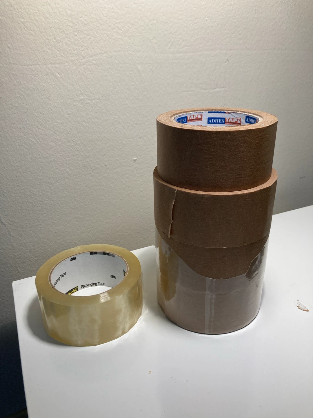 4 Brown paper Tape and 1 3M Packaging Tape