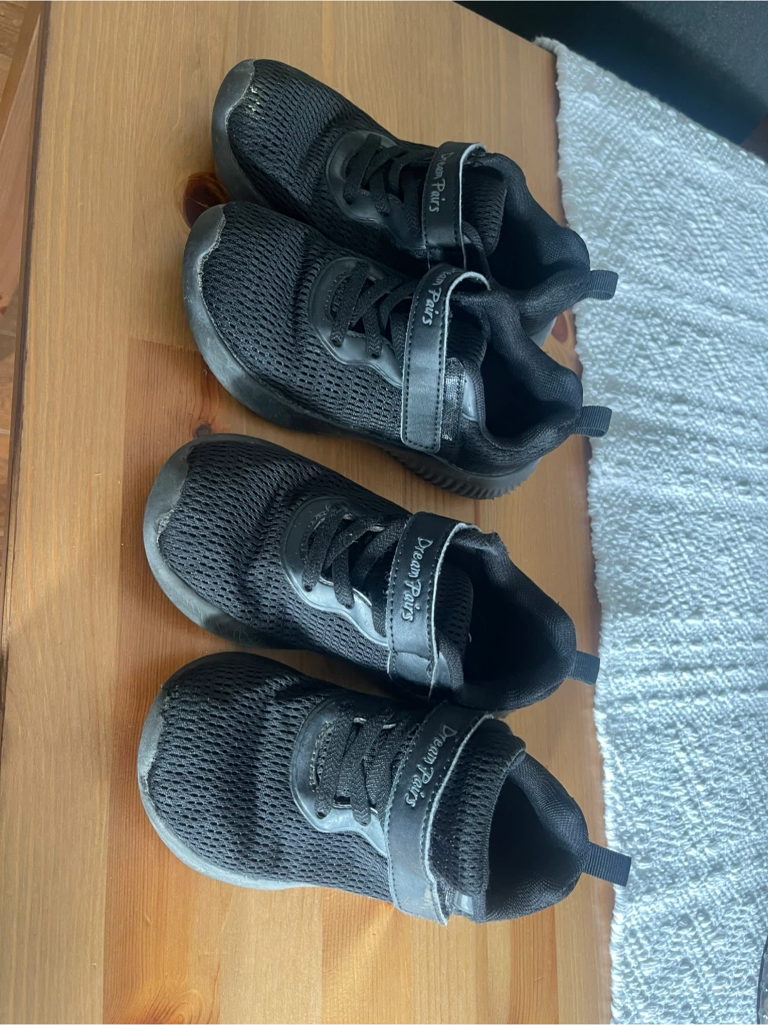 Two pairs of black Dream Pairs sneakers