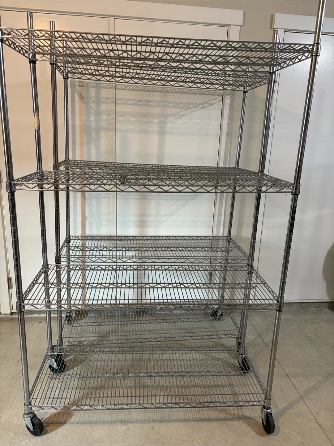 A set of 2 Costco Chrome Wire Shelving Unit with Wheels