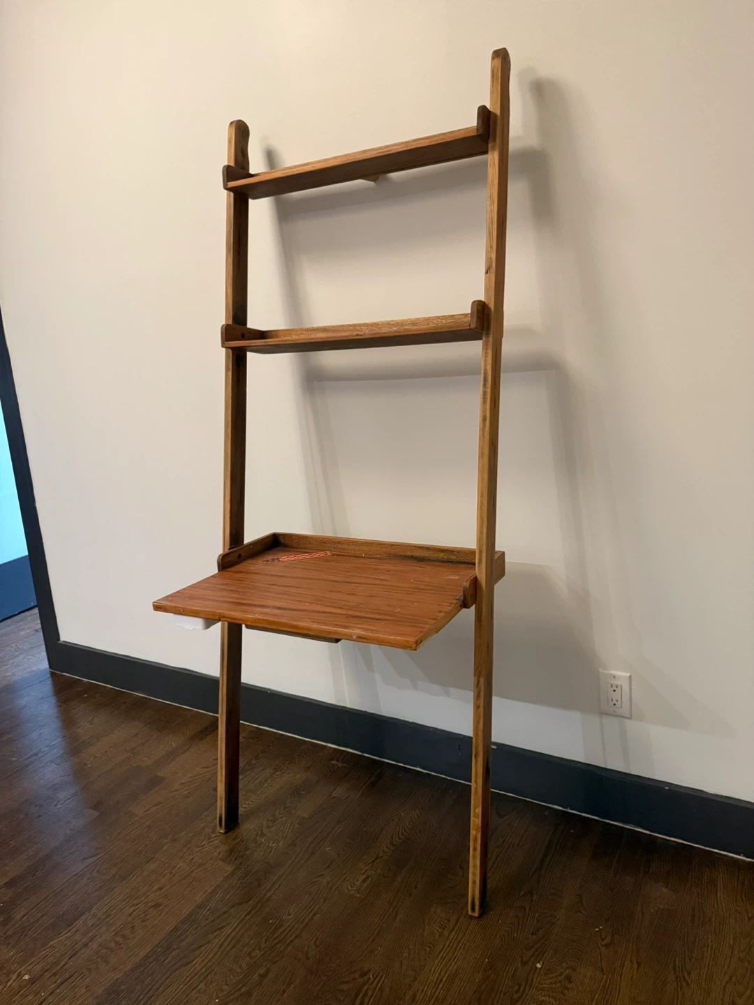 Bookshelf leaning desk