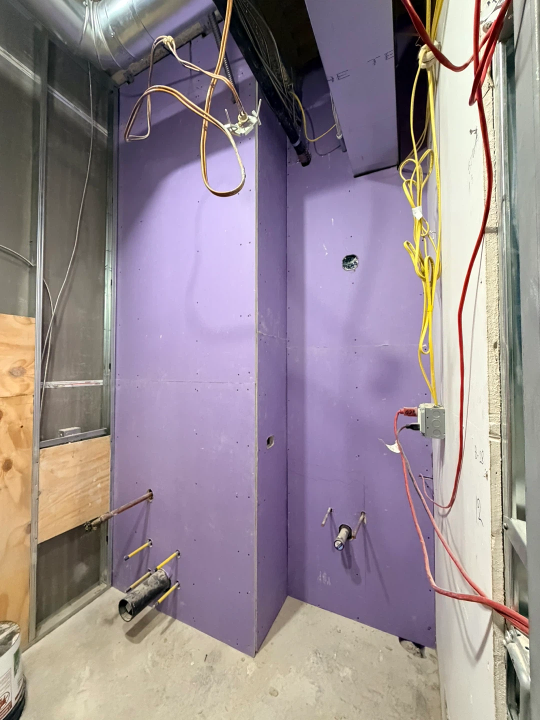 Construction Site Hallway with Drywall and Exposed Utilities - photo 2