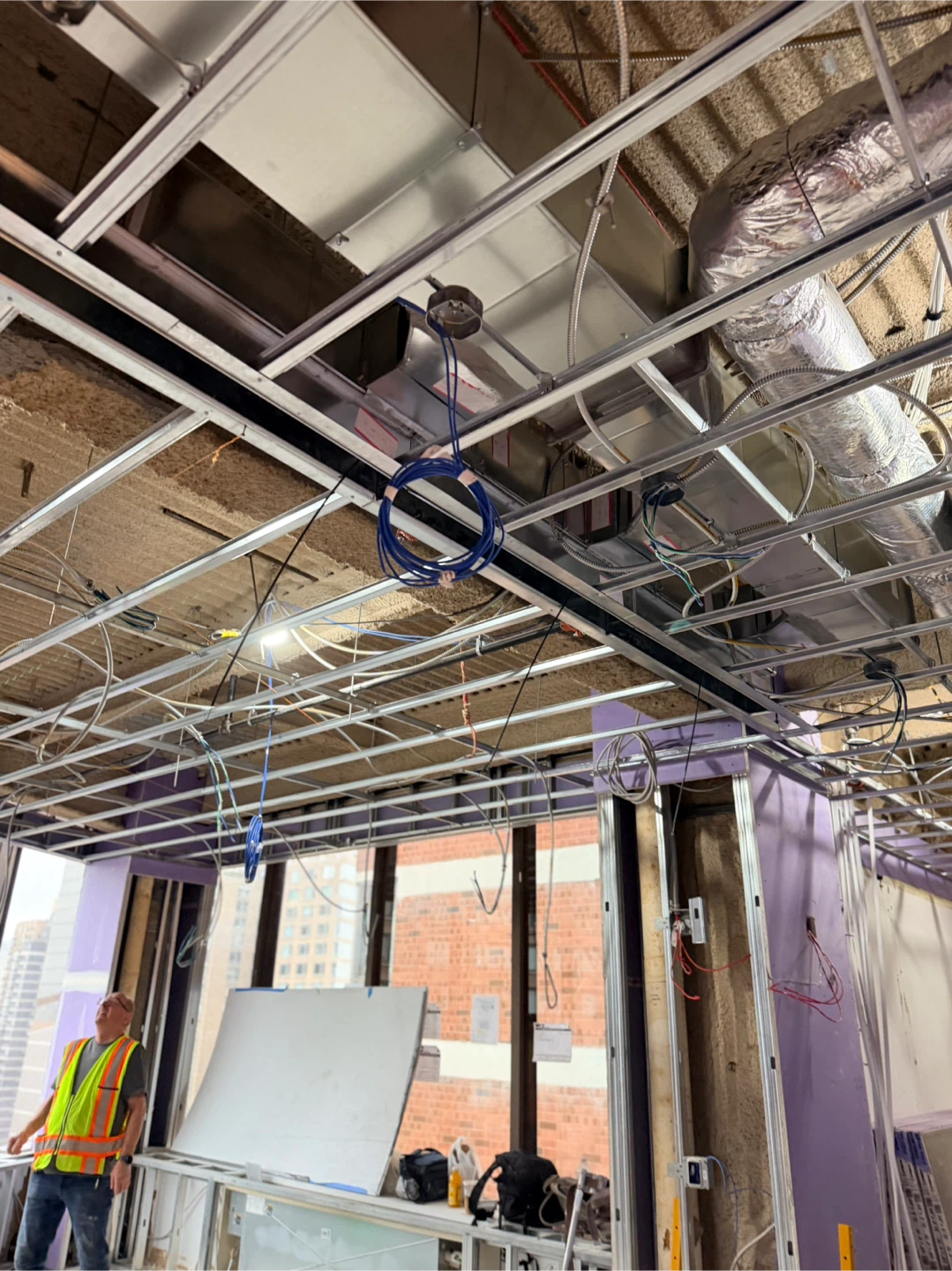 Construction Site Hallway with Drywall and Exposed Utilities - photo 4