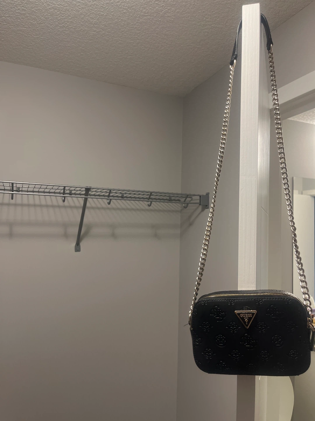 Black Guess crossbody bag with chain strap