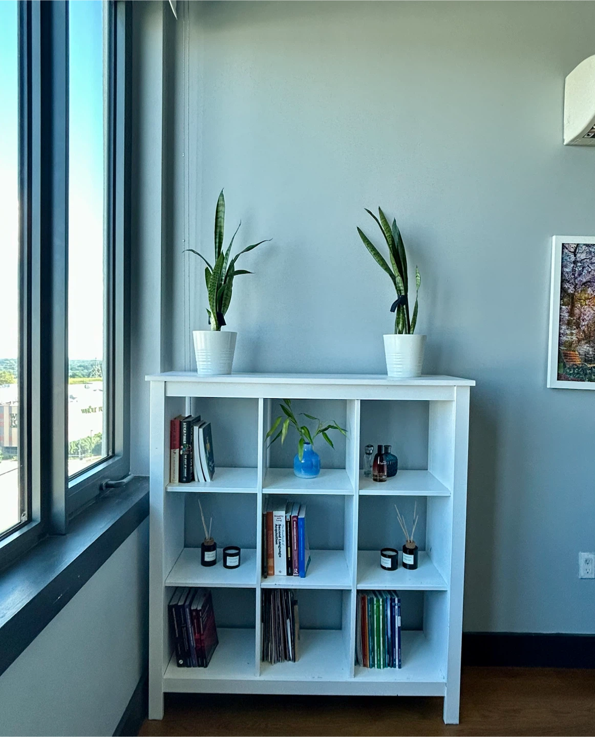 an IKEA KALLAX3x3 cube shelf in white