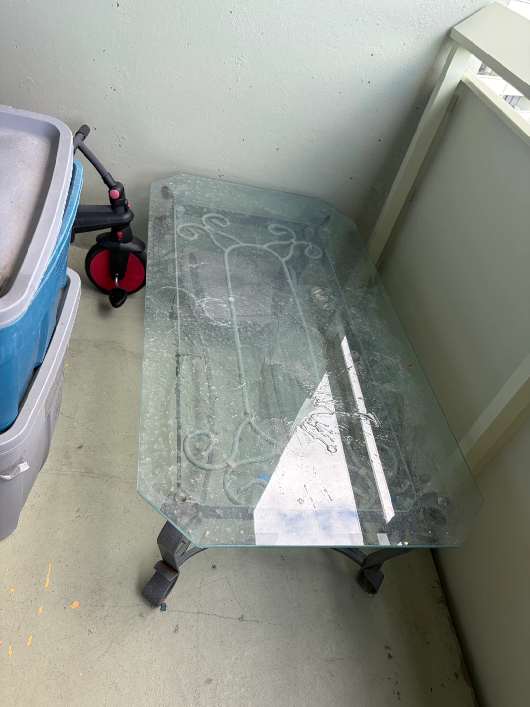 Glass top coffee table with metal base