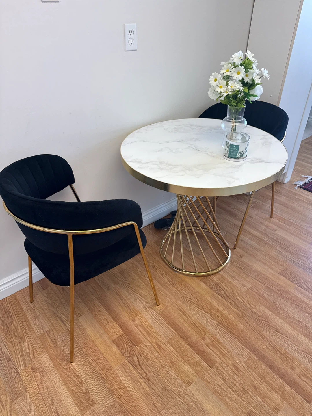 Black velvet chairs and faux marble bistro table