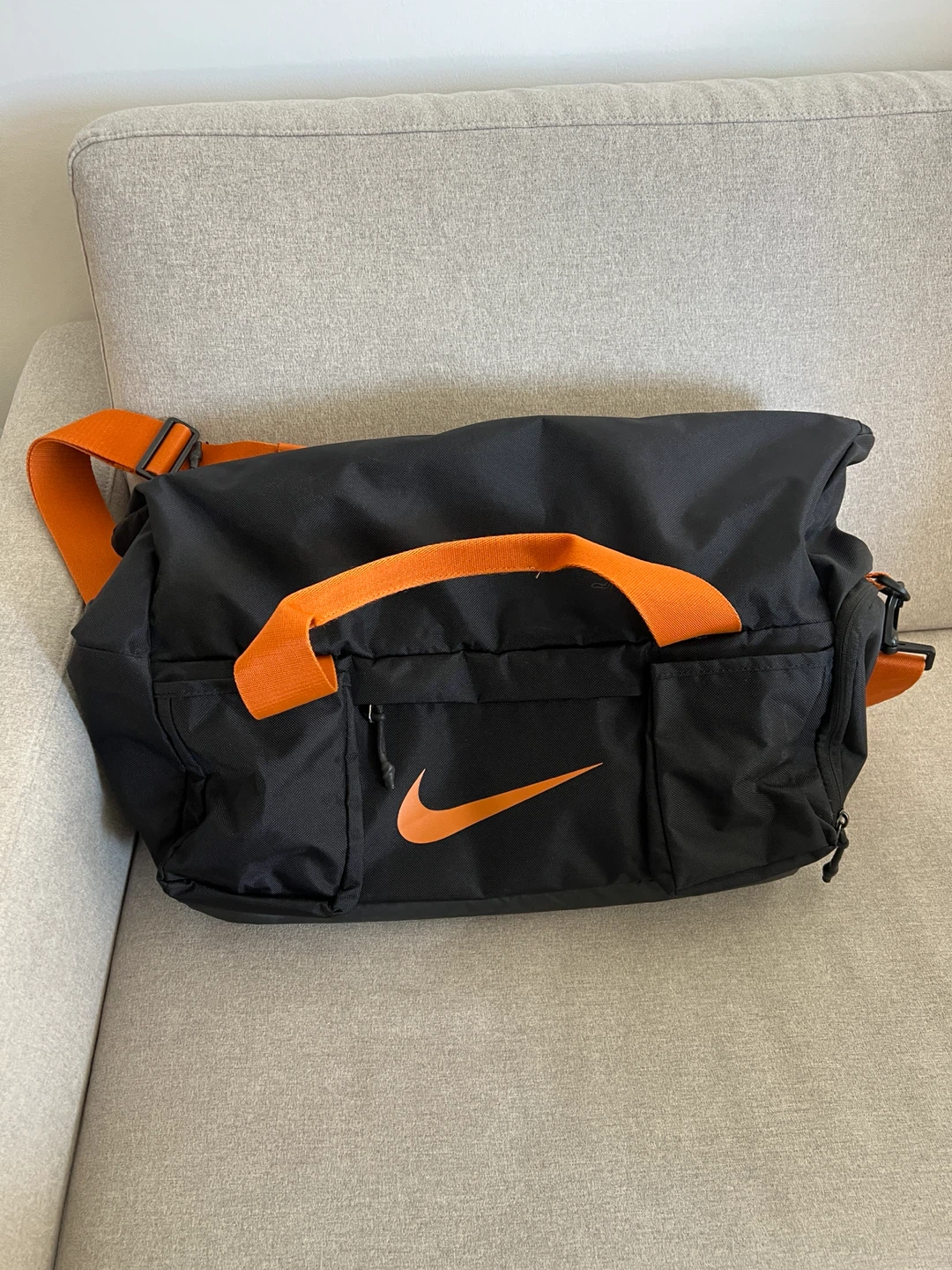 Nike black and orange duffel bag