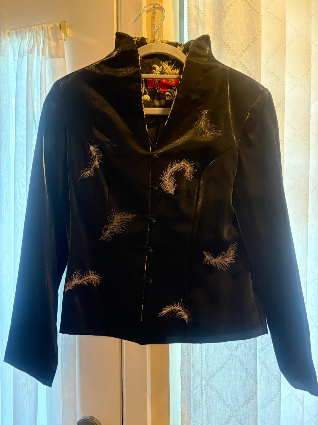 Black embroidered jacket with feather pattern