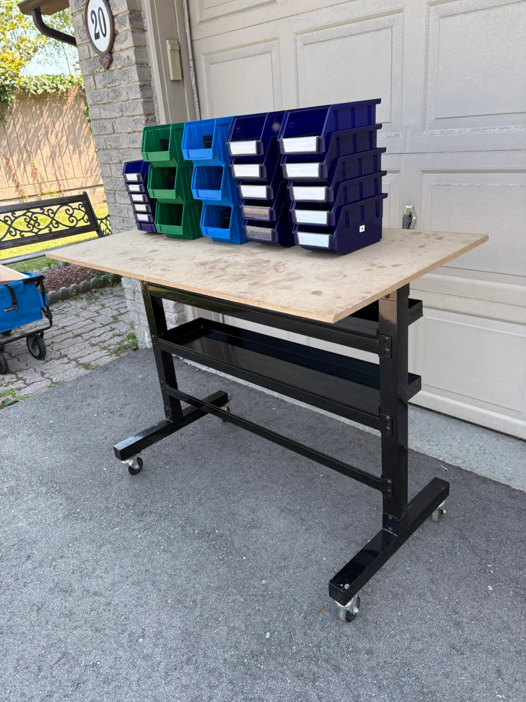 Moveable work bench with bins for storage.