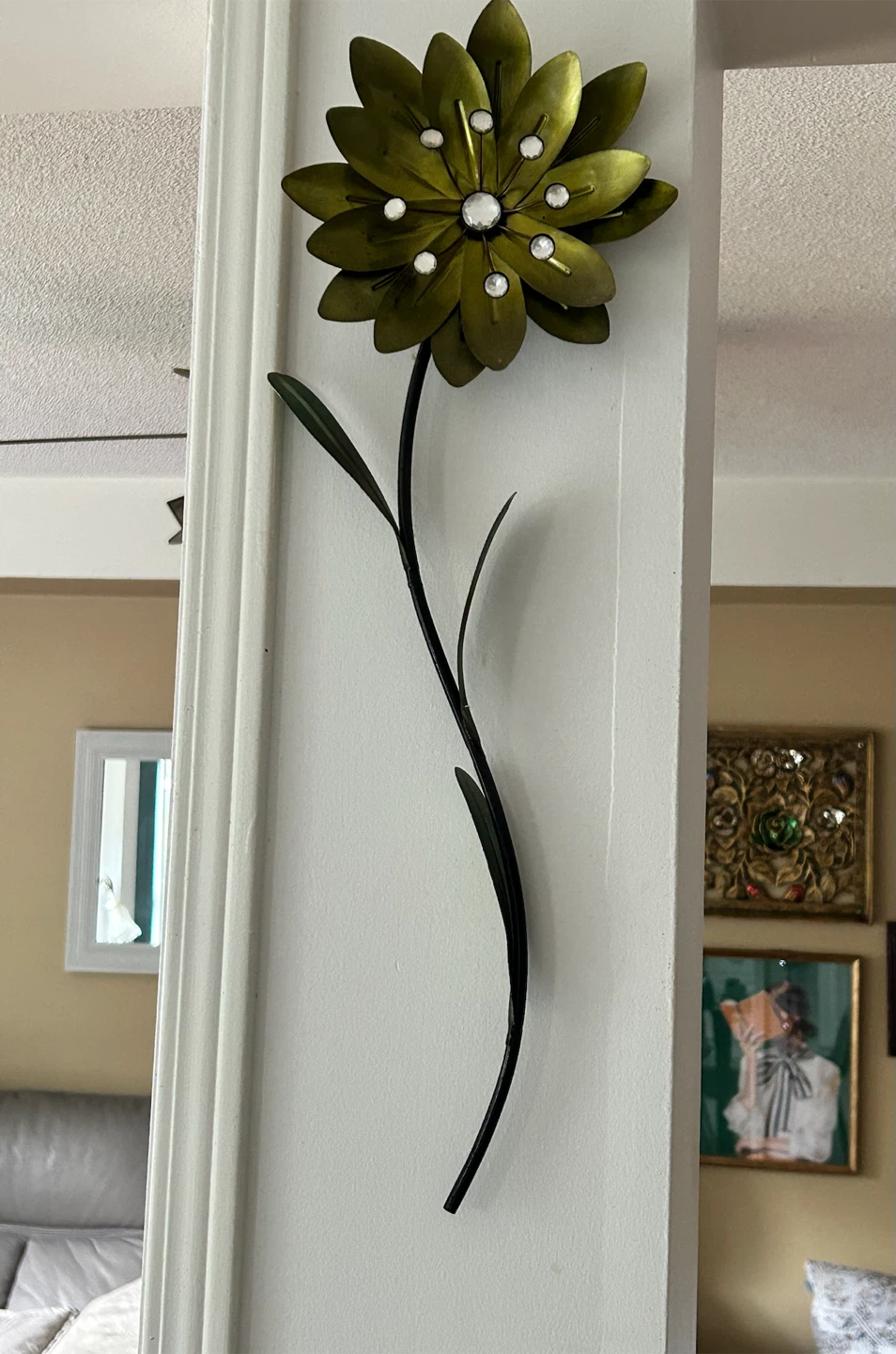 Green metal flower with faux gems