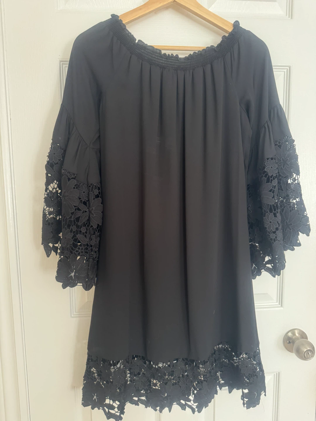Black off-the-shoulder dress with lace details