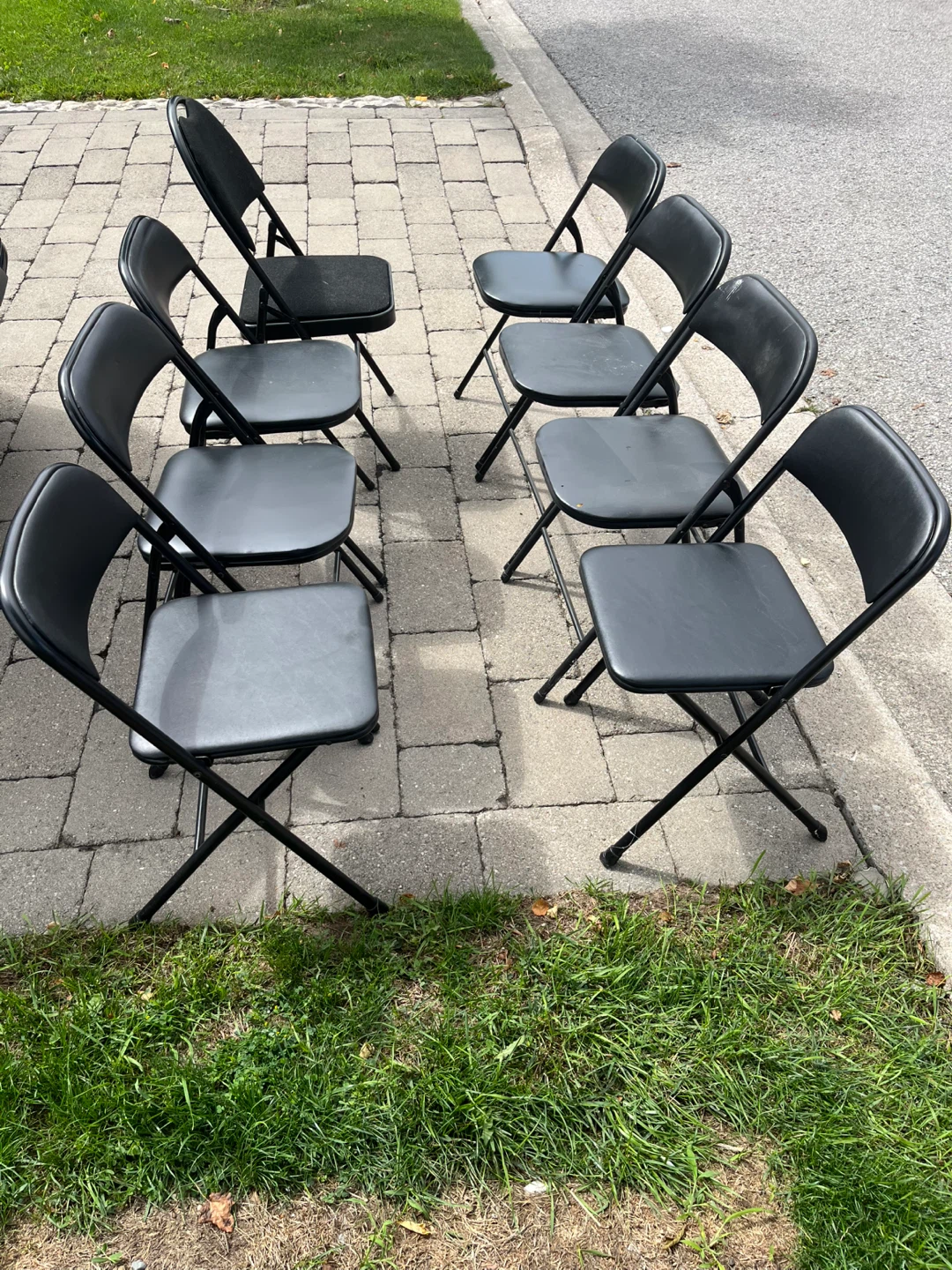 8 black folding chairs