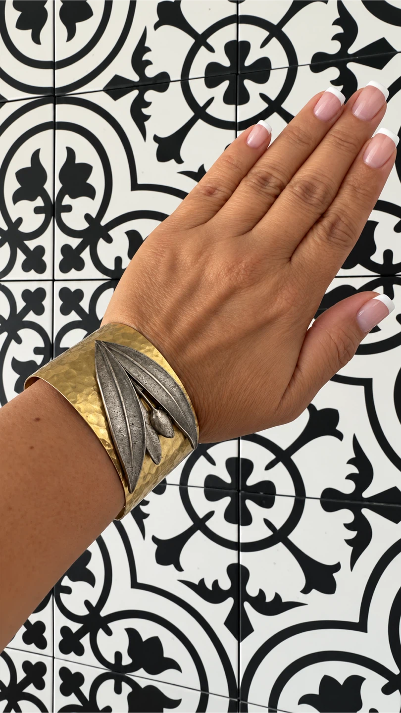 Gold cuff bracelet with leaf detail