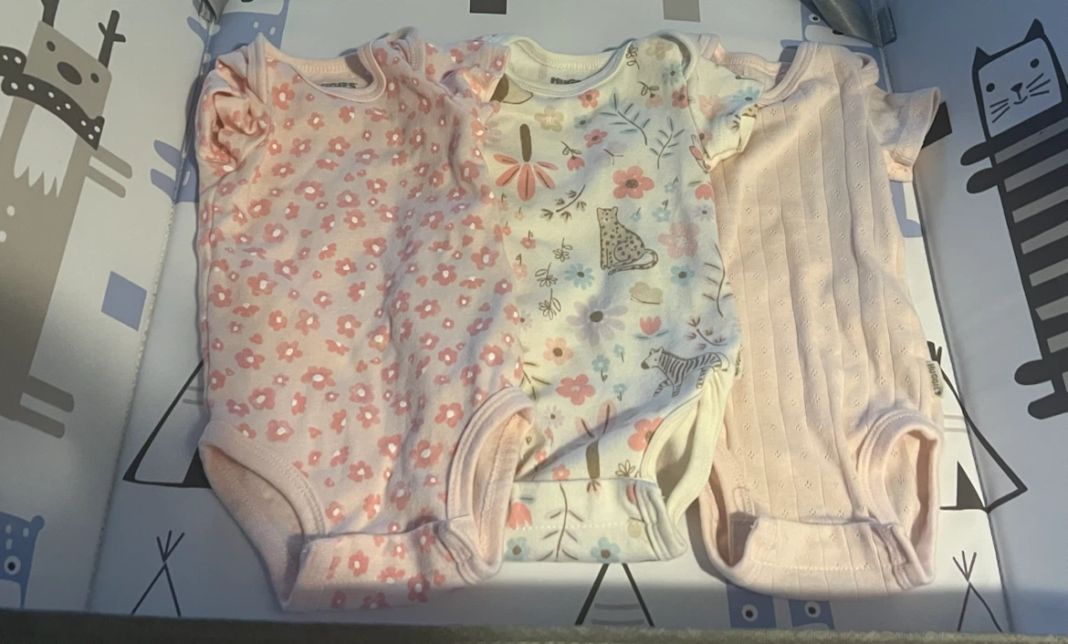 New newborn onesies and sleeping gowns and diapers